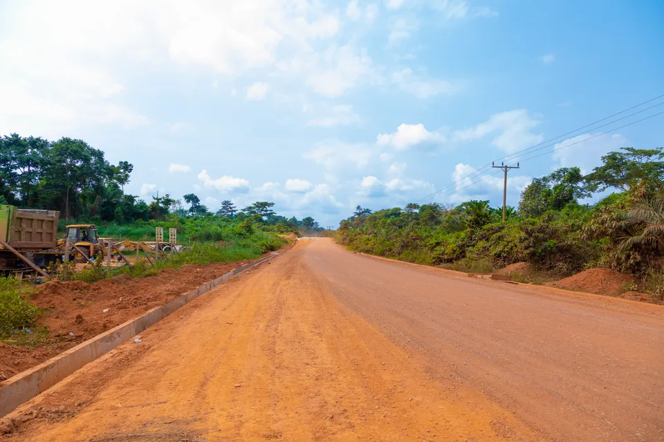 Finished laterite road with concrete side drains